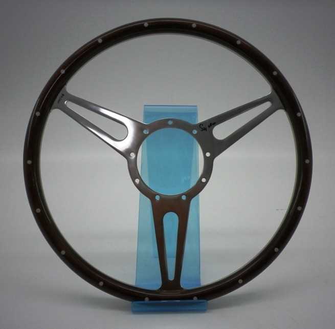 Lot 98 - Stirling Moss signed and numbered steering wheel