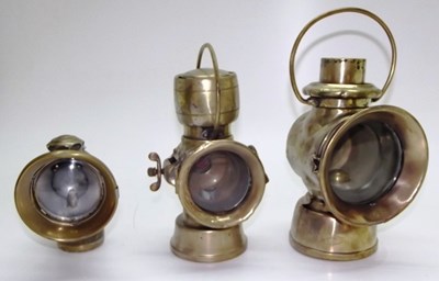 Lot 053 - Three early Lucas brass lamps