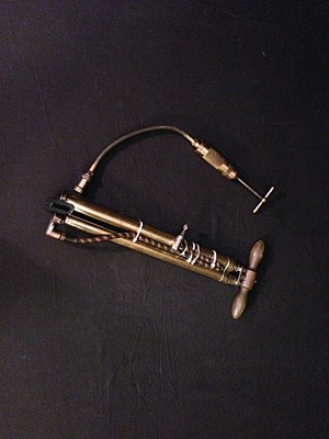 Lot 109 - Brass twin barrel foot pump