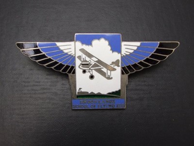 Lot 112 - A 'Brooklands School of Flying' badge. nickel plated brass with blue.