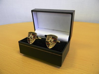 Lot 155 - a set of unisex Porsche logo cufflinks