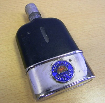 Lot 157 - a leather covered spirits flask for the early Morris owner...