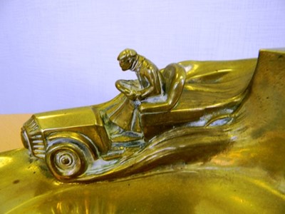 Lot 169 - An Edwardian brass motoring desk top pen tray with inkwell