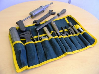 Lot 173 - W.O. Bentley toolkit in green fabric tool roll