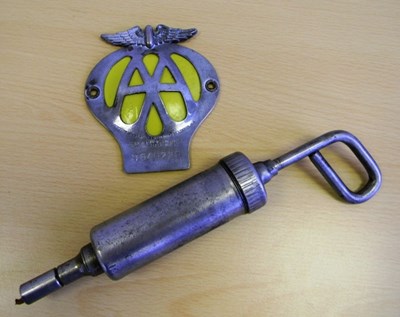 Lot 177 - a Grease Gun by Tecalmit and an AA classic car badge.