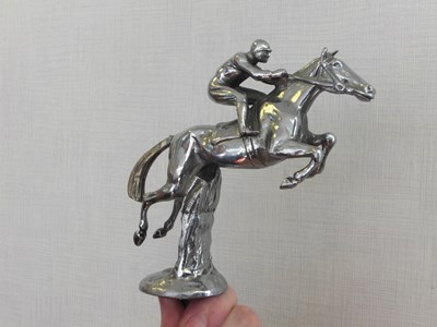 Lot 183 - a wonderful 1927 Horse and Rider over Hedges Car Mascot by Paillet. Superb condition.