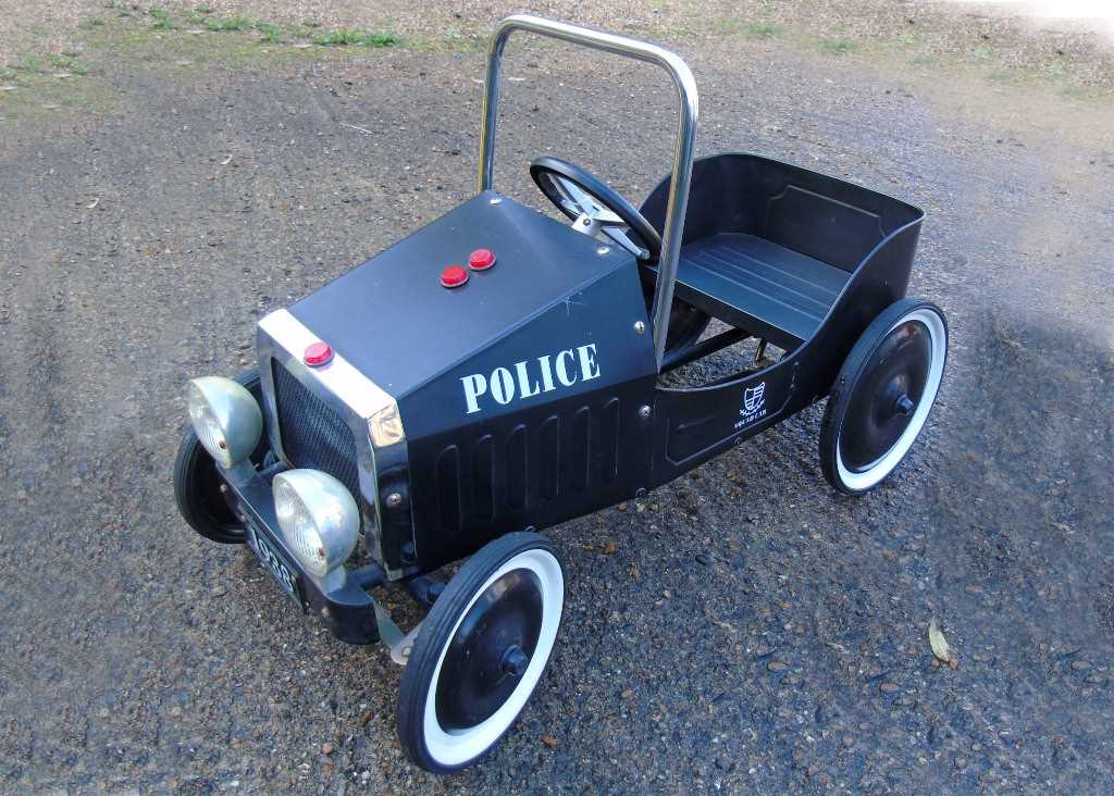 Click for high resolution Lot 48 - A 1938 black police pursuit childes pedal car