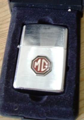 Lot 112 - MG lighter and watch