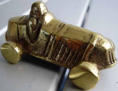 Lot 139 - brass model of a racing car