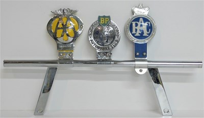 Lot 6 - A badge bar with AA, RAC and BP motoring badges and an early alloy grill possibly Austin Healey.