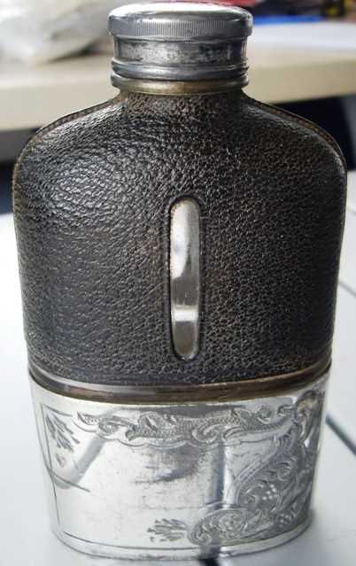 Lot 23 - EPNS and leather spirit hip flask
