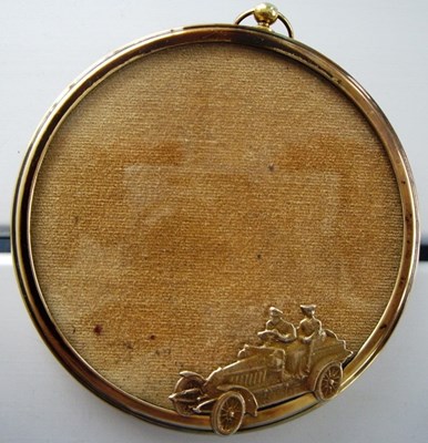 Lot 35 - A small brass circular picture frame