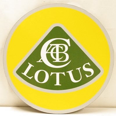 Lot 38 - A round garage wall or showroom wall hanging sign in the form of the Lotus car bonnet badge