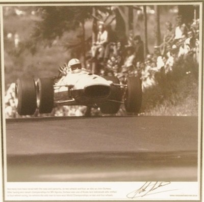 Lot 52 - A high quality framed and glazed photo print signed by John Surtees.