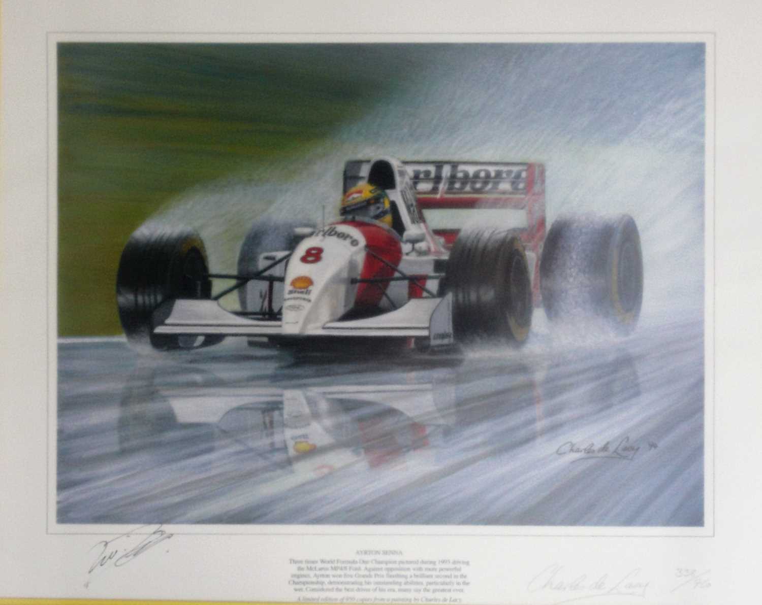 Click for high resolution Lot 17 - A framed and glazed print showing Ayrton Senna driving a McLaren