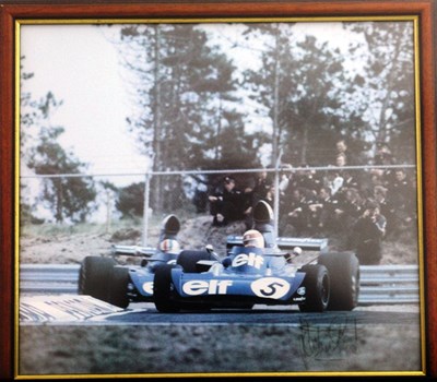 Lot 22 - A framed and glazed print showing Jackie Stewart