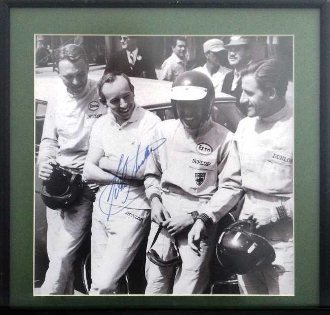 Click for high resolution Lot 24 - A framed and glazed print showing a quartet of F1 drivers