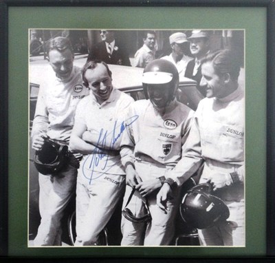 Lot 24 - A framed and glazed print showing a quartet of F1 drivers