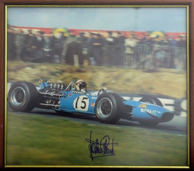 Lot 28 - A framed and glazed print showing Jackie Stewart