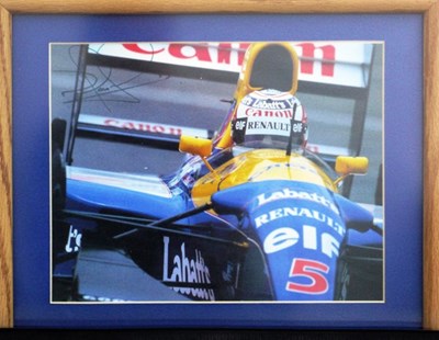 Lot 56 - A framed and glazed print showing Nigel Mansell