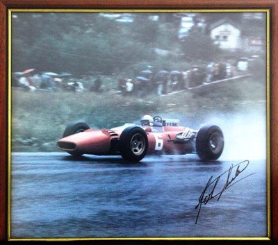 Lot 72 - A print showing John Surtees driving a Ferrari in the wet